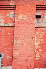 Worn painted red brick