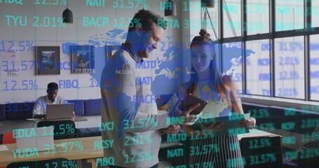 Business casual co-workers reviewing smartphone and documents in open-plan office, with market data