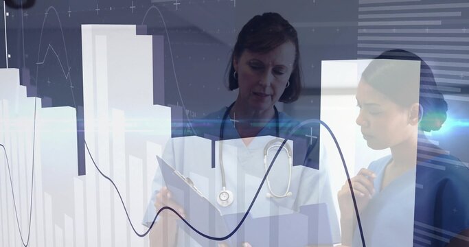 Medical team reviewing data on clipboard with stethoscope in clinic with bar charts, line graphs - Powered by Adobe