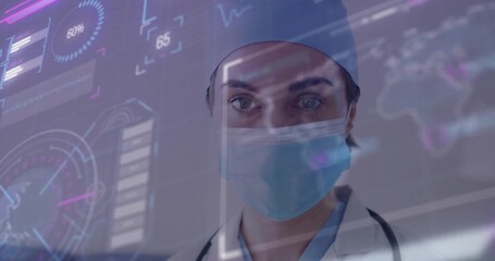 Analyzing doctor in scrubs surgical cap and mask examining interface in clinic with stethoscope