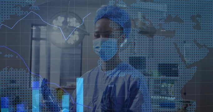 Medical professional wearing surgical gear analyzing data in surgical room with transparent display