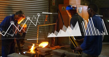 Pouring molten metal, workers in coveralls guiding flow at foundry with crucible, hoist, charts