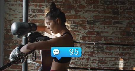 Leaning boxer in sportswear catching breath in ring, with gloves and comment bubble showing 95