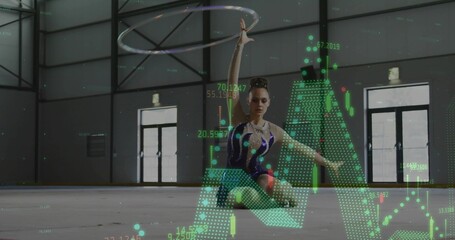 Kneeling gymnast in dark blue leotard spinning hoop in sports hall with floating digital overlays