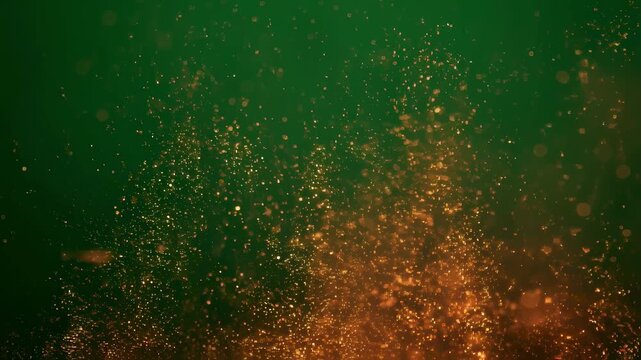 Closeup of tiny ember bursts flickering and sparking vividly on a green screen background ideal for enhancing night campfire visuals.