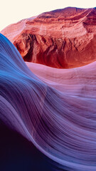 Obraz premium Purple and red sandstone formations of Antelope Canyon in Arizona illuminated by desert light, showcasing smooth textures and wave-like shapes carved by centuries of erosion into abstract patterns