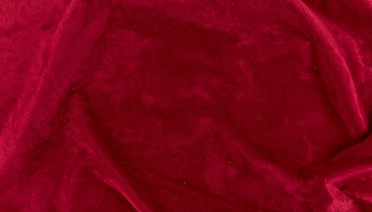 Deep crimson velvet fabric folds