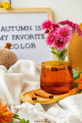 Letter board with text AUTUMN IS MY FAVORITE COLOR Fall Bouquet for Thanksgiving holiday. Seasonal Warm colorful blossom flowers arrangement festive decoration. Selective focus 