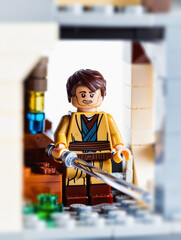 Fototapeta premium LEGO Star Wars Jedi Character Mini Figure, Jedi Knight Minifigure With Lightsaber, London, UK