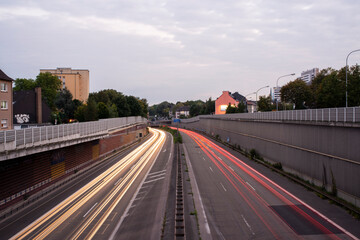 Long exposure traffic light trails on a divided urban highway at twilight