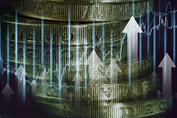 Stack of money coins with up arrow interest rate