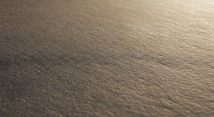 Abstract dark textured surface background with subtle golden light and rough grain detail