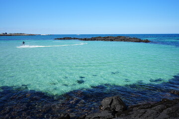 clear blue sea and rock coast