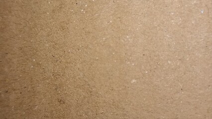 Textured Kraft Paper Background. Rough Recycled Cardboard with Visible Fibers and Speckles. Eco-Friendly Design Element.
