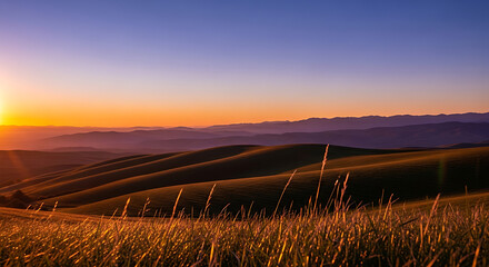 Rolling hills at sunset with golden grass