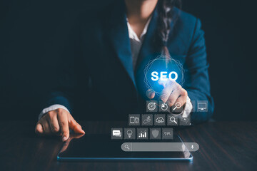 Person working on digital tablet manages search engine optimization, SEO, social media, content,...