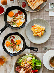 fried eggs with bacon and vegetables