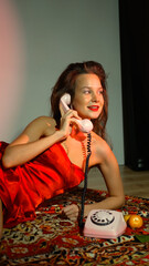 Portrait photo of happy smiling woman with bright makeup holding telephone receiver. Excited retro...
