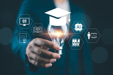 Innovative education concept with A person holding light bulb and graduation cap icon, representing e-learning, digital skills, AI knowledge and future learning in modern technology environment.