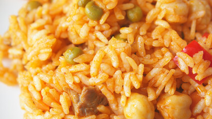 Delicious spicy rice dish with vegetables and meat
