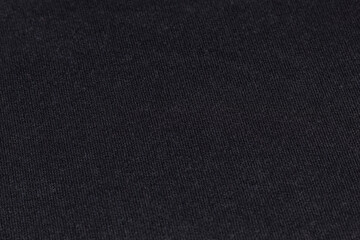 Close-up of black fabric texture, neutral background for mockups, fashion, materials, and advertising photography