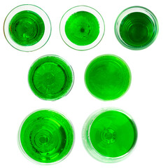 Top View of Green Drink in Glass on White Background