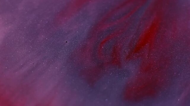 Flowing paint stream. Ripple fluid. Blur blue purple crimson color ink in acrylic water red drip spilling on abstract art background.