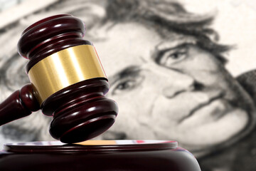 Dollar bill and a judge's gavel