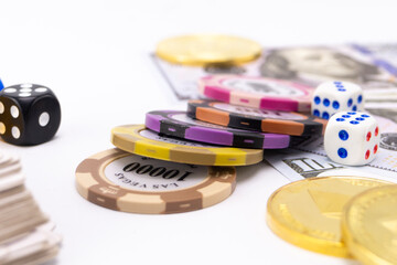 Poker Chips, Dice, and Money on White Background - Gambling and Casino Concept.