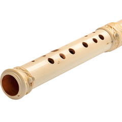 Naklejka premium Close-up view of an ornate bamboo flute against a stark black background