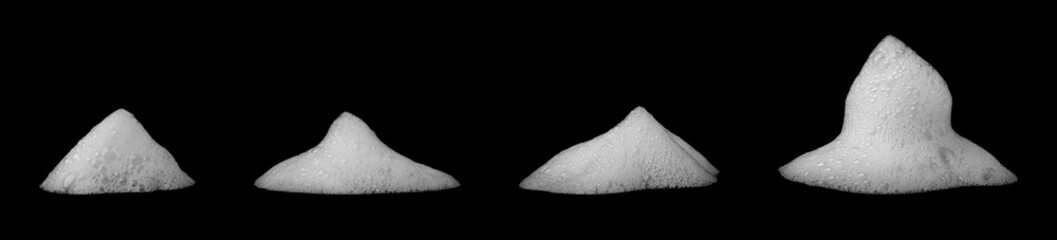 White soap foam bubbles isolated on black background, abstract texture for cleaning, hygiene, or...