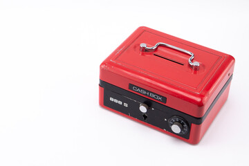 Red Cash Box with Black Trim and Silver Handle on White Background, Close-up.