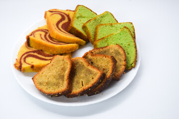 Sponge cake is a cake based on flour (usually wheat flour), sugar, butter and eggs, and is sometimes leavened with baking powder. It has a firm, yet well aerated structure, similar to a sea sponge. 

