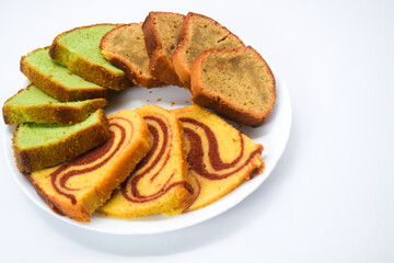 Sponge cake is a cake based on flour (usually wheat flour), sugar, butter and eggs, and is sometimes leavened with baking powder. It has a firm, yet well aerated structure, similar to a sea sponge. 

