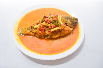 Ikan Nila bumbu kuning, Traditional Menu from West Indonesia, Made from Fried Tilapia and yellow sauce made from turmeric