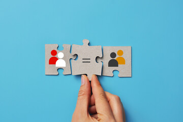 Puzzle concept of racial and cultural equality with diverse skin tones and equality sign