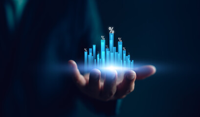 Hand holding bar graph with percentage icons, representing interest rate adjustment, investment...