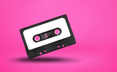 Fototapeta premium Retro old tape cassette on color background.