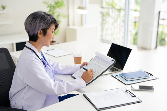 Doctor and clipboard writing notes for hospital schedule, history record or healthcare checklist. Paper, documents or person with life insurance with medical aid, prescription or test results.