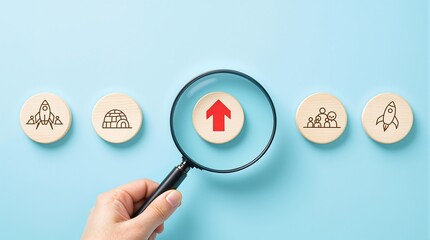Business growth strategy analysis with magnifying glass on arrow icon and startup symbols on blue background