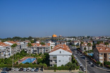 Fototapeta premium Türkiye, Side, August 21, 2025, panorama of the city of Side with hotels, houses, swimming pools, streets and a mosque