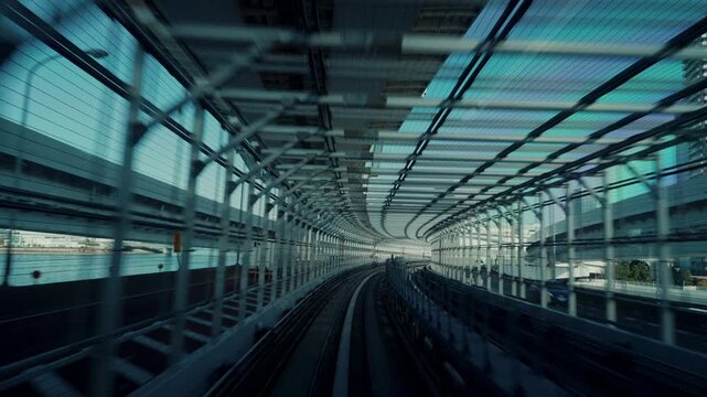 4K Motion timelapse POV shot from automated train at night in Tokyo, Japan.