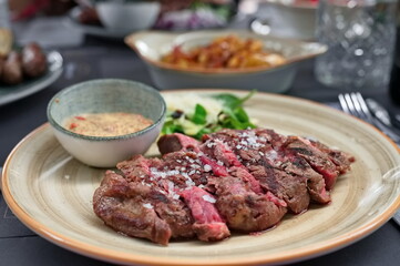 Closeup of rib-eye steak on the table