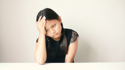 The little girl felt sad and her expression showed, her mood was very sad about something