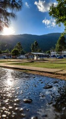 Fototapeta premium Sunny, tranquil town square, water feature