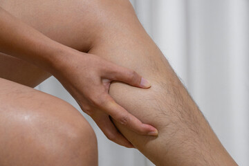 Close-up of calf pain from daily strain, showing muscle tension and discomfort. Ideal for ads on tendon care, muscle therapy, cramp relief, or leg pain treatment.
