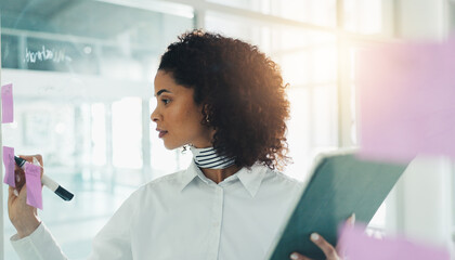 Fashion, brainstorming and woman in office with sticky note, creativity and writing for trend report. Ideas, market research and designer in workplace with tech, vision and agenda for style analysis.