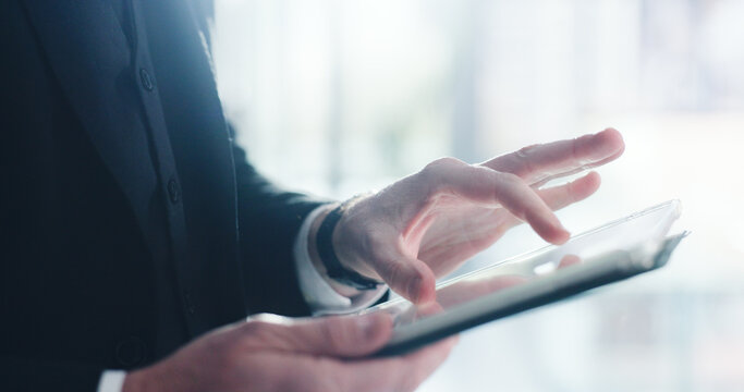 Hands, businessman and tablet in office for online planning, app and internet connection. Professional person, tech and scroll for corporate research, communication or networking email at workplace