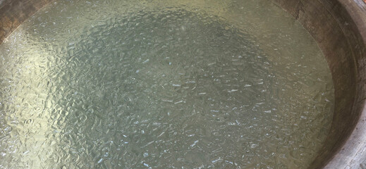 Crushed ice in metal container for cooling.