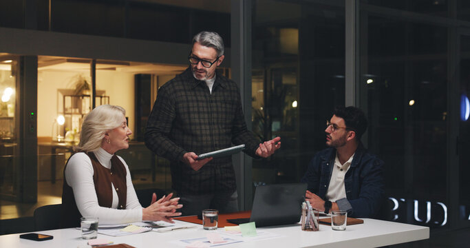 Business people, tablet and planning at night for brainstorming, schedule or project deadline. Group, employees or team working late with technology for creative development or agenda in office